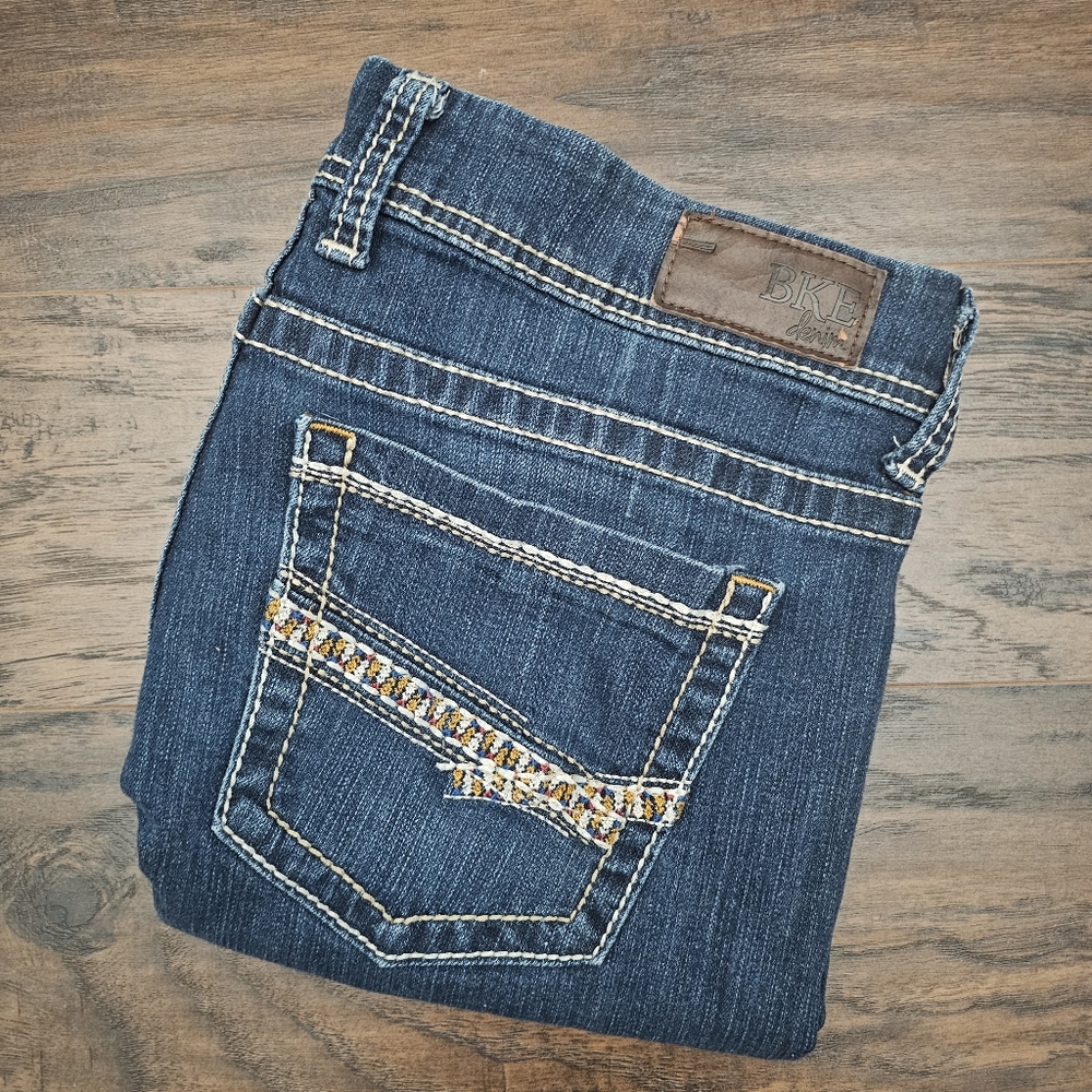 BKE Women's Boot Cut Jeans in Blue with Brown Patch
